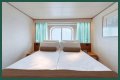 An old Holland America cruise ship is turning residential, letting travelers live at sea for $8,000 a month while it circumnavigates the globe